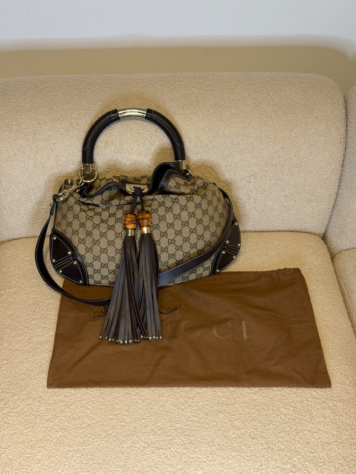 Gucci – Borsa a mano in tessuto GG con nappe