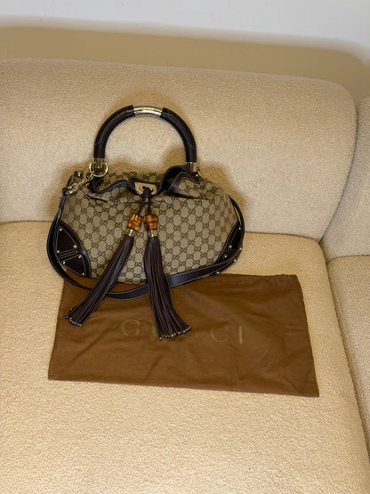 Gucci – Borsa a mano in tessuto GG con nappe