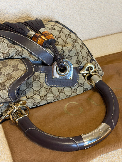 Gucci – Borsa a mano in tessuto GG con nappe