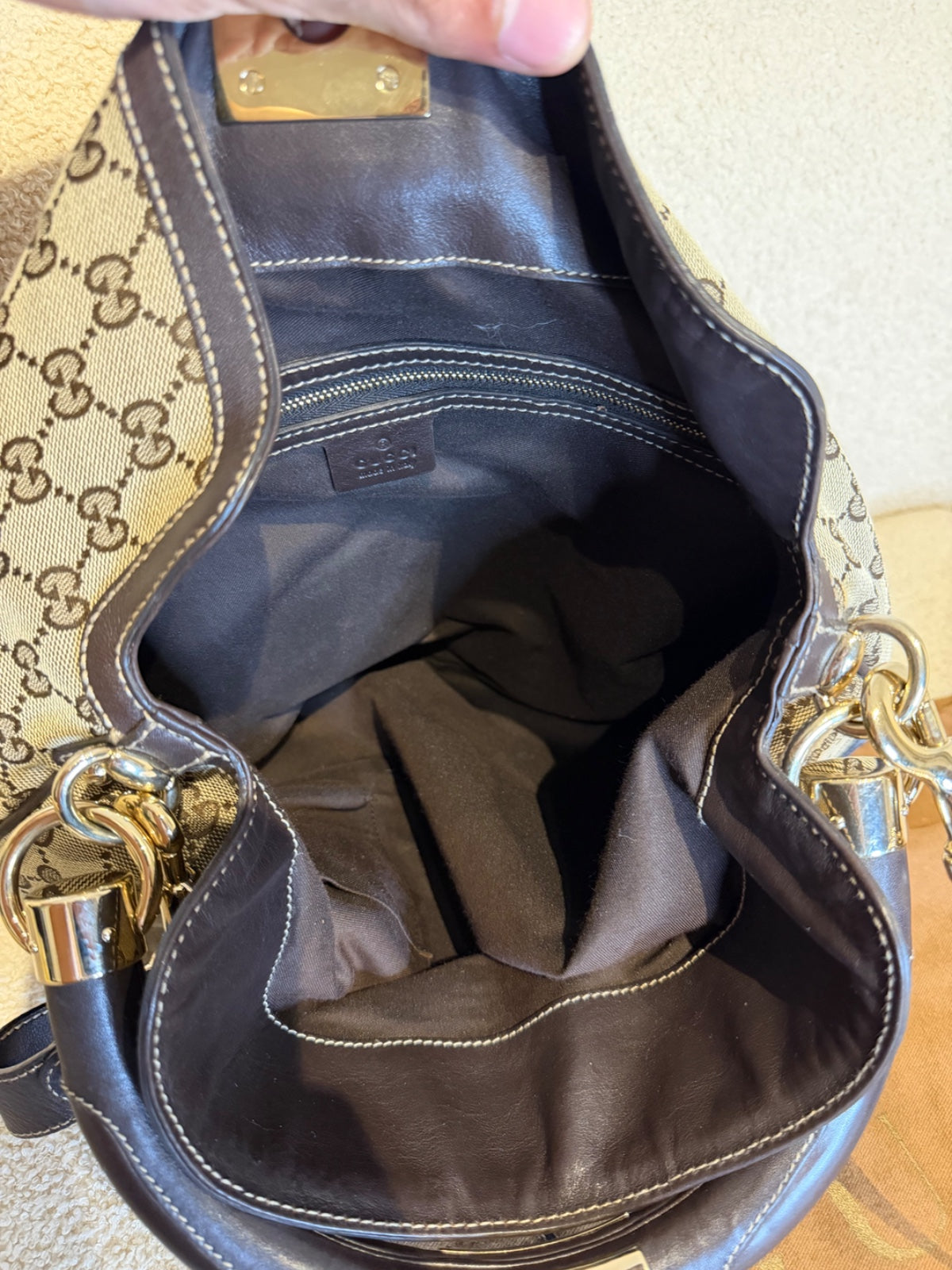 Gucci – Borsa a mano in tessuto GG con nappe