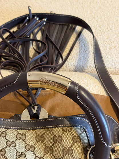 Gucci – Borsa a mano in tessuto GG con nappe