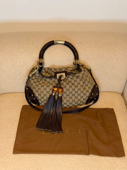 Gucci – Borsa a mano in tessuto GG con nappe