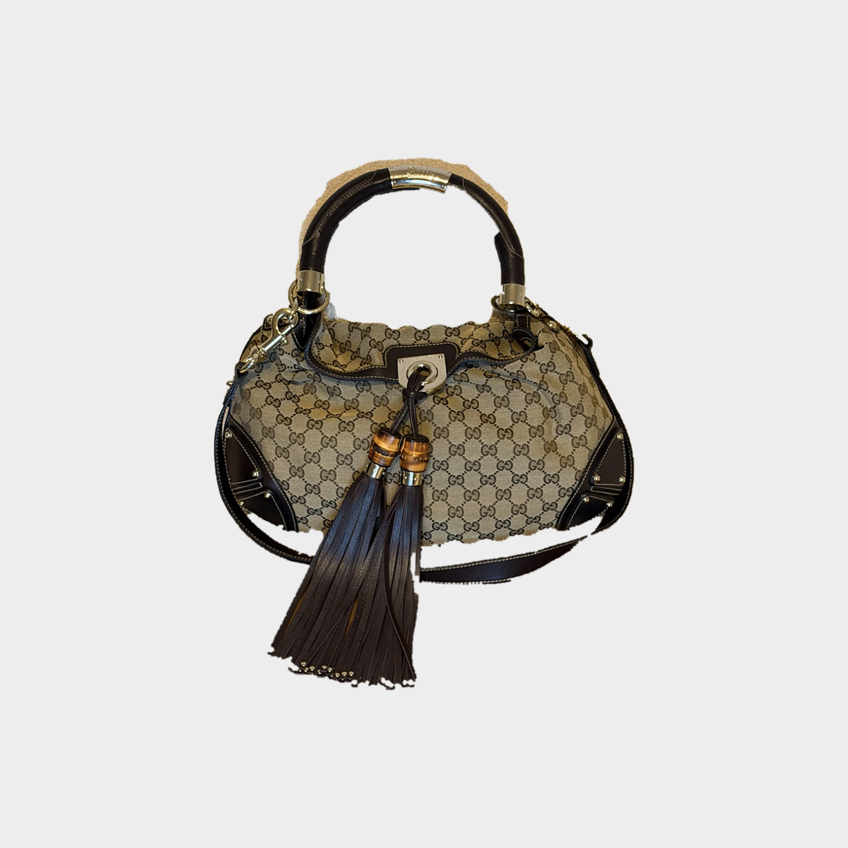 Gucci – Borsa a mano in tessuto GG con nappe